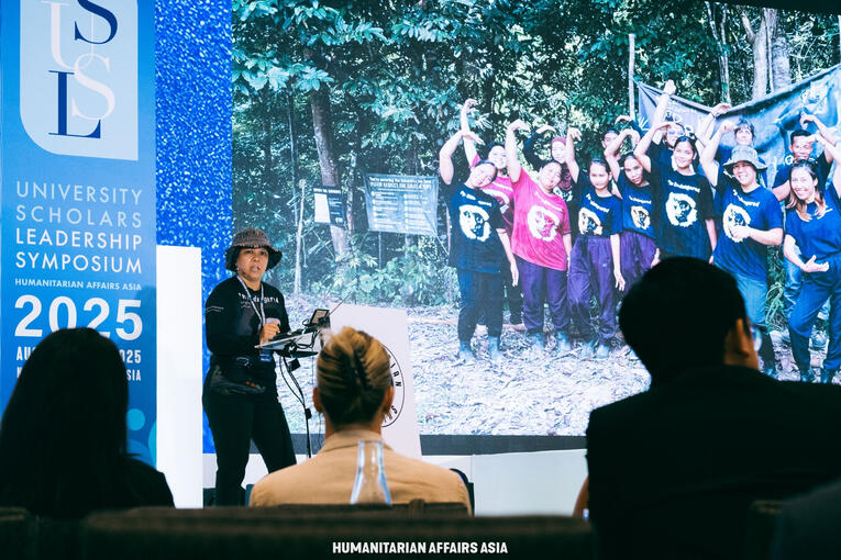 Bam speaking at University Scholars Leadership Symposium 2025.